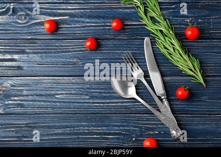 Composition with set of cutlery on wooden background Stock Photo