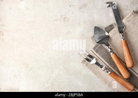 Various kitchen utensils on light textured background Stock Photo