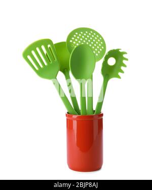 Kitchen utensils in cup, isolated on white Stock Photo