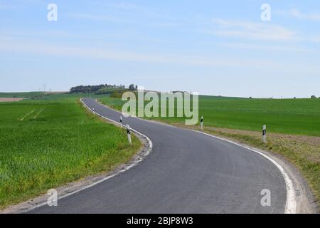empty road through spring landscape in the Eifel Stock Photo