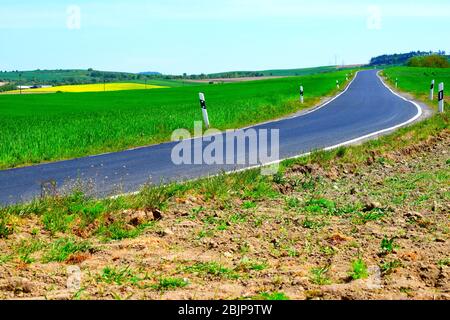 empty road through spring landscape in the Eifel Stock Photo