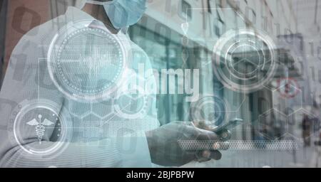 Digital illustration of man wearing coronavirus Covid19 mask in street over cells spreading Stock Photo