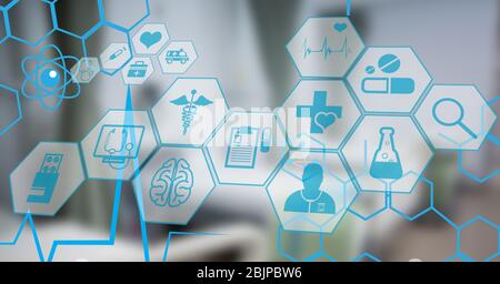Digital illustration of medical icons over an empty hospital room in background Stock Photo