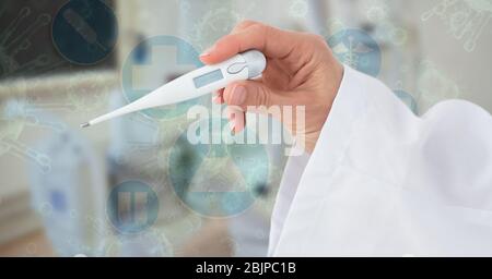 Digital illustration of a doctor holding an electronic thermometer over medical icons Stock Photo