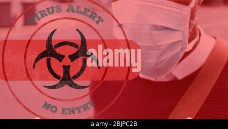 Digital illustration of hazard sign with a bandage and Virus alert with a man wearing coronavirus co Stock Photo