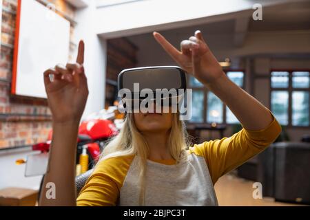 Young woman using a VR headset Stock Photo