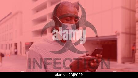 Digital illustration of a hazard sign with a word Infection under it over a man wearing a face mask Stock Photo