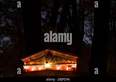 Candles on a tomb at Rakowicki Cemetery in Krakow, Poland 2019. Stock Photo