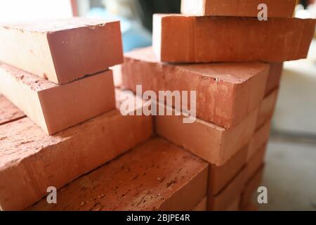 Building materials are on floor, stack red bricks Stock Photo