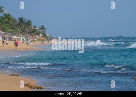 HIKKADUVA, SRI LANKA - FEBRUARY 19, 2020: On Hikkaduwa beach on a sunny day Stock Photo