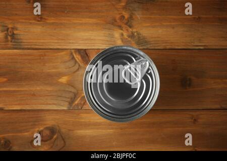 Tin can on wooden background Stock Photo