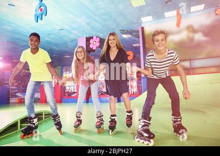Group of teenagers at roller skating rink Stock Photo
