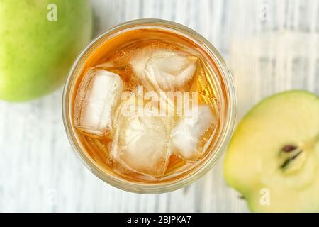 Glass with fresh apple juice on table, close up Stock Photo