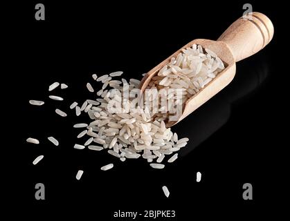 White rice in wooden scoop Stock Photo