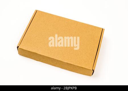 One closed rectangular cardboard box isolated on white background Stock Photo