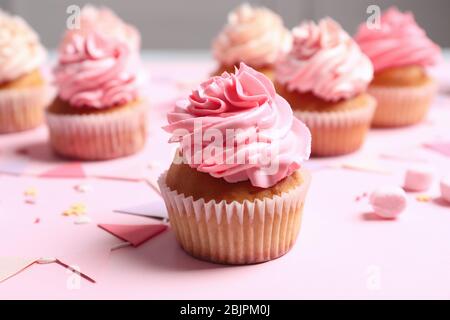 Many yummy cupcakes on table Stock Photo