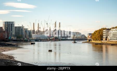 Battersea Power Station and the River Thames at low tide, West London. Building and construction work being carried out on the famous London landmark. Stock Photo