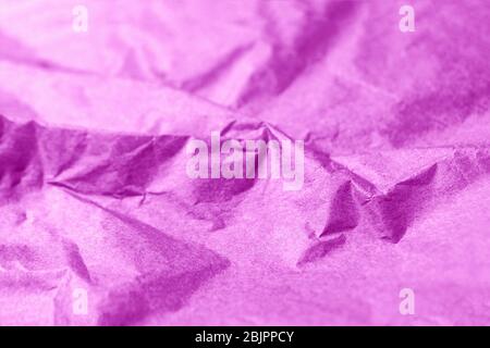 Crumpled fuchsia color paper texture abstract background Stock Photo