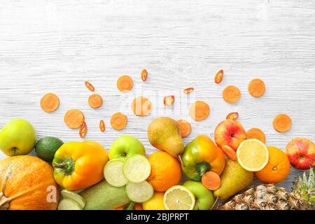 Various fruits and vegetables on wooden background Stock Photo