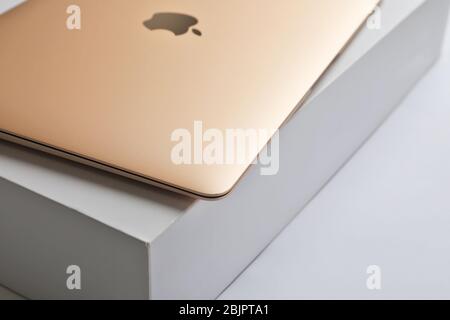 KIEV, UKRAINE - OCTOBER 12, 2017: Apple gold MacBook on box Stock Photo