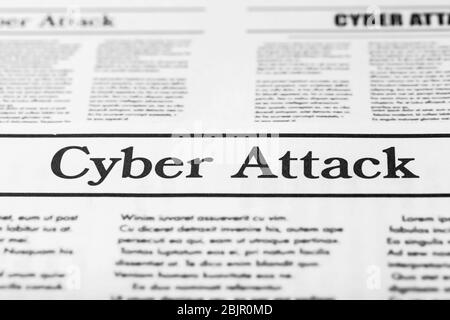 Newspaper with text CYBER ATTACK, close up Stock Photo