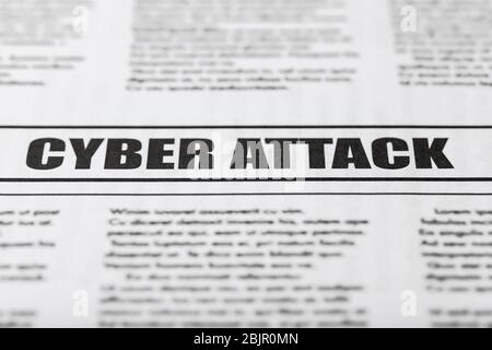 Newspaper with text CYBER ATTACK, close up Stock Photo