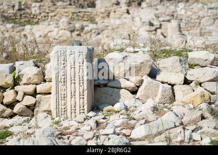 Decoration on a handcarved building block among the ruings of the ancient Roman city of Amathus, Cyprus. Stock Photo