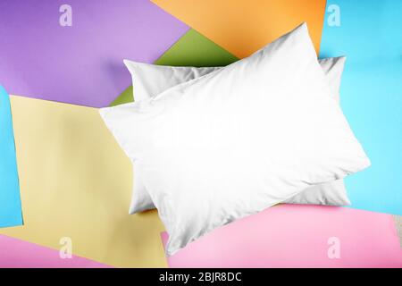 Blank soft pillows on color background Stock Photo