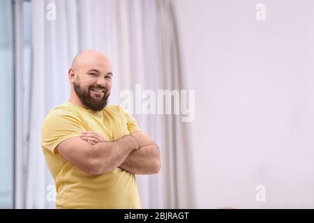 Overweight young man at home Stock Photo