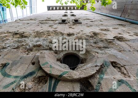 Bullet holes and shell holes on the facade of the Reichsbahnbunker air raid shelter in central Berlin Stock Photo