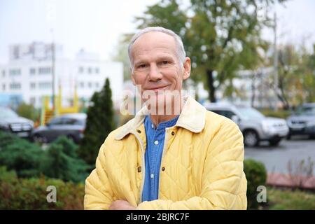 Charismatic senior man outdoors Stock Photo