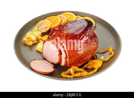 Plate with traditional honey baked ham, fruits and vegetables, isolated on white Stock Photo