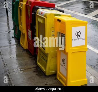 A collection of newspaper distribution boxes in Chelsea in New York including a box for pamphlets from the Japanese religion Happy Science on Tuesday, April  21, 2020. (© Richard B. Levine) Stock Photo