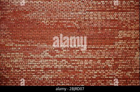 Weathered stained old red brick wall background Stock Photo