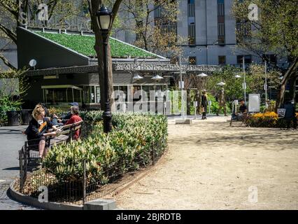 Visitors to Madison Square Park and the Shake Shack in New York on a warm sunny Tuesday, April 28, 2020. (© Richard B. Levine) Stock Photo