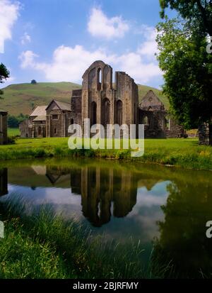 Valle Crucis Abbey, Llangollen, Wales, UK, looking WSW over the abbey fishpond to the E end of the church (presbytery) with S transept & E range to L. Stock Photo
