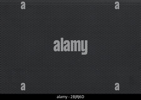 Metal mesh background pattern. Closeup of audio speaker protection perforated plate Stock Photo