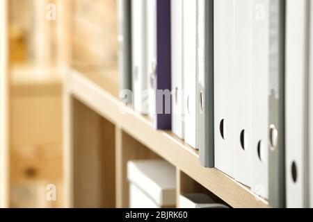 Many folders with documents on shelf in archive, closeup Stock Photo