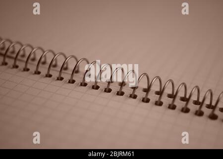 open notebook on a spiral, squared paper closeup. Stock Photo