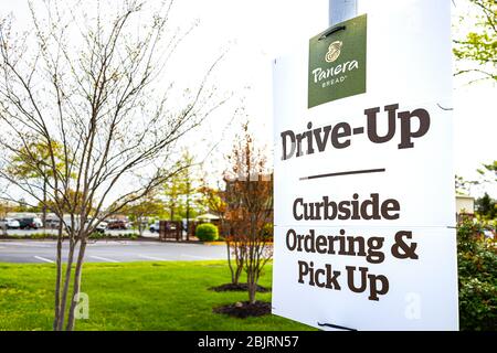 Herndon, USA - April 27, 2020: Virginia Fairfax County street sign for open Panera restaurant for take-out curbside pick-up during coronavirus covid-1 Stock Photo