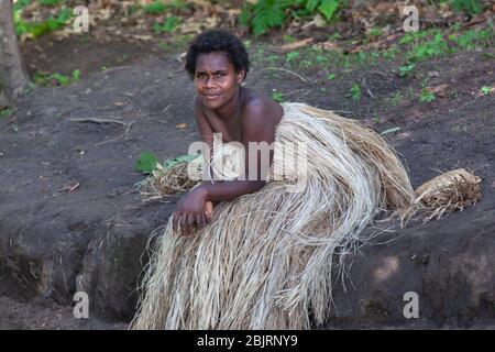 Tanna, Vanuatu - June 2019: young beautiful Melanesian girl in traditional indigenous dress Stock Photo