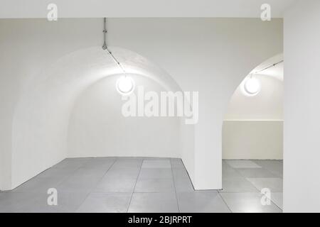 Arches on the lower floor incorporated from an earlier building on the site. 75 Farringdon Road, London, United Kingdom. Architect: Buckley Grey Yoema Stock Photo