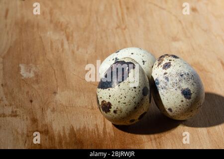 quail eggs on a light tree blue background, close up, copy space Stock ...