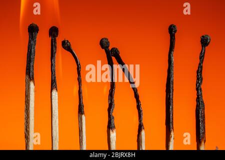 burning seven matches in a row in the corners of a leadership chart on a Lush Lava background. close up copy space Stock Photo