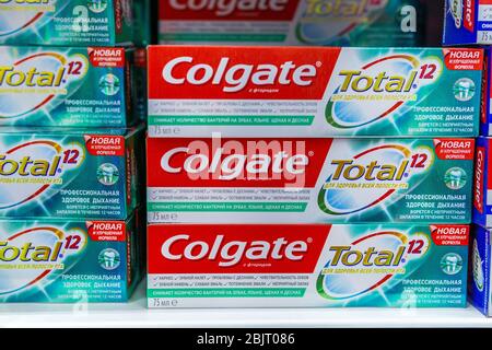 Tyumen, Russia-April 26, 2020: Colgate total 12 hours of protection. Toothpaste products on store shelves Stock Photo