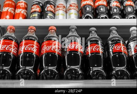 KYIV, UKRAINE - NOVEMBER 14, 2017: Stand with many bottles of Coca-Cola in supermarket Stock Photo
