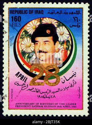 IRAQ - CIRCA 1984: A stamp printed in Iraq shows Saddam Hussein, circa 1984 Stock Photo