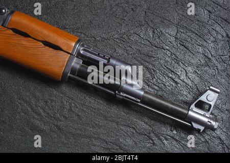 the gun on black concrete Stock Photo