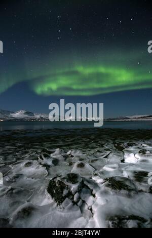 A spiral Aurora Borealis over the Northern Norway near Tromso. High ...