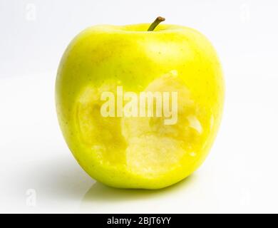 bitten green apple on a white background. close up Stock Photo